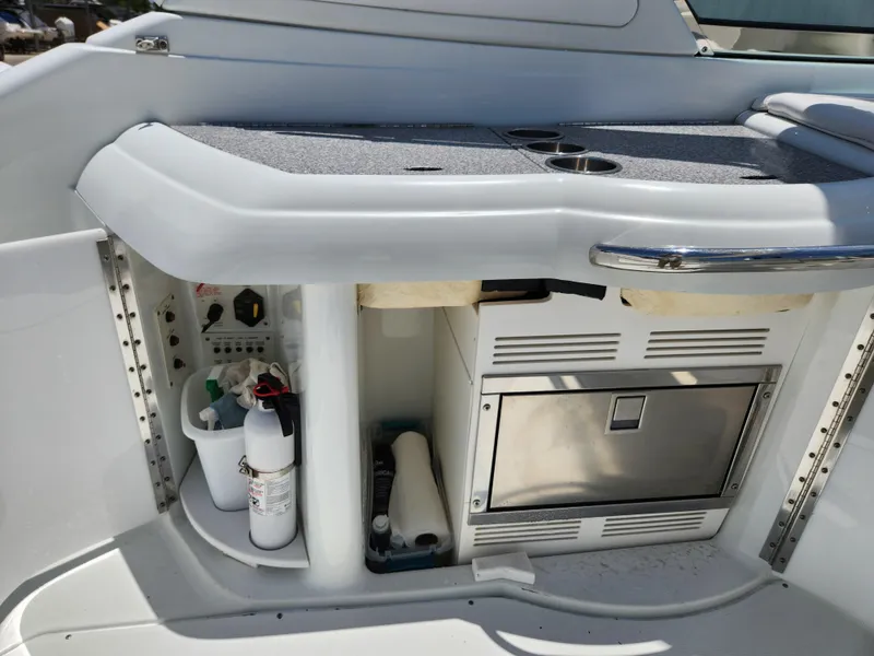 Slide: The Image of 2007 Formula 330 Sun Sport boat interior with storage and mini fridge. - 19
