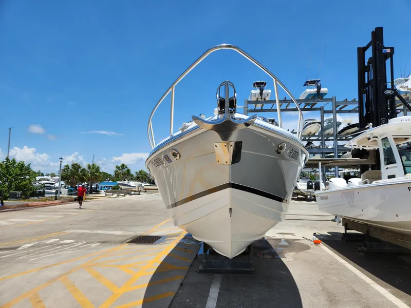 Slide: The Image of 2007 Formula 330 Sun Sport boat on dry dock under clear blue sky. - 2