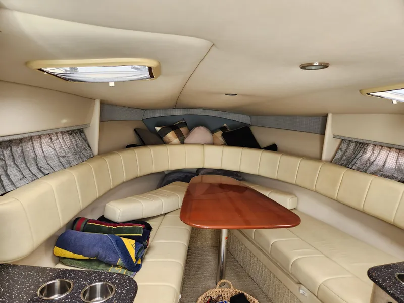 Slide: The Image of 2007 Formula 330 Sun Sport cabin interior with seating, table, and skylights. - 21