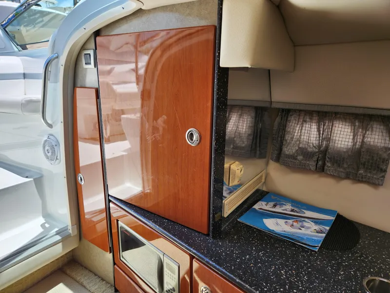 Slide: The Image of 2007 Formula 330 Sun Sport interior with wood cabinetry and countertop. - 24