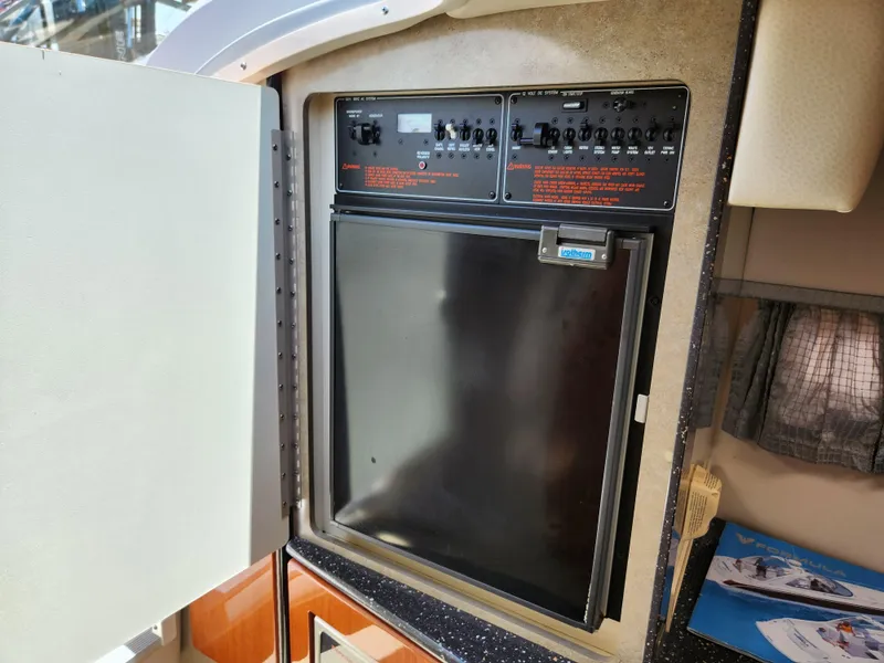 Slide: The Image of 2007 Formula 330 Sun Sport control panel and refrigerator in cabin interior. - 27