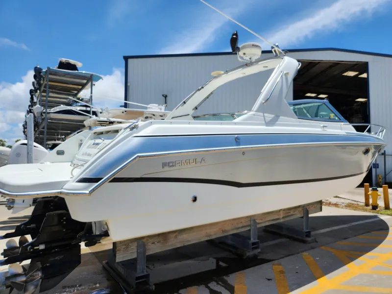 Slide: The Image of 2007 Formula 330 Sun Sport boat on dry dock, ready for maintenance. - 3