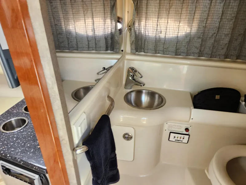 Slide: The Image of 2007 Formula 330 Sun Sport bathroom with sink, mirror, and toilet. - 32