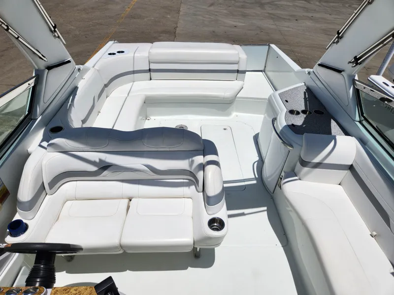 Slide: The Image of 2007 Formula 330 Sun Sport boat interior with white seating and helm. - 35
