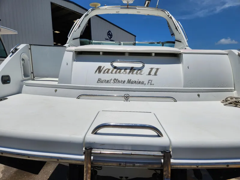 Slide: The Image of 2007 Formula 330 Sun Sport boat at marina, rear view with ladder and nameplate. - 5