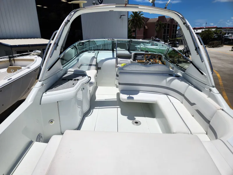 Slide: The Image of 2007 Formula 330 Sun Sport boat interior with white seating and modern dashboard. - 6