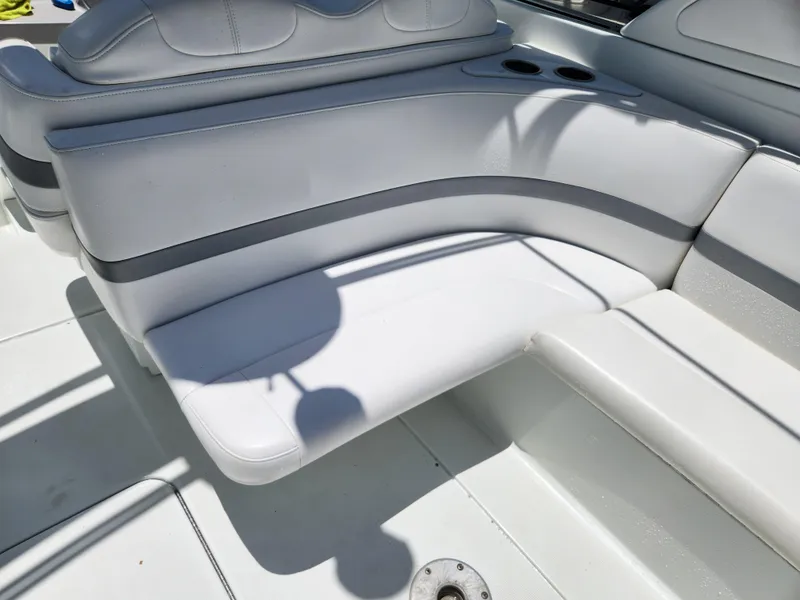 Slide: The Image of 2007 Formula 330 Sun Sport boat interior with white seating and cup holders. - 8