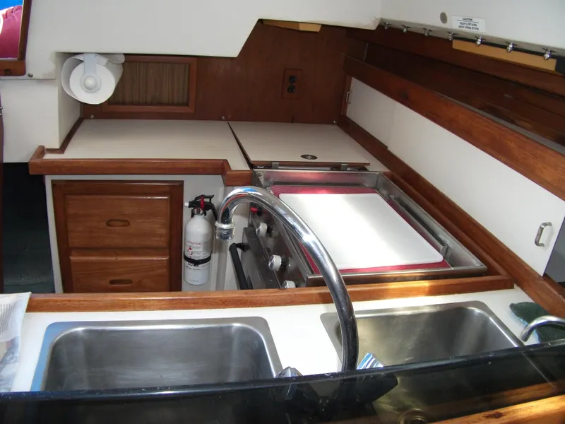Slide: The Image of Interior view of 1992 Catalina 30 MkII yacht kitchen with sink and stove. - 10