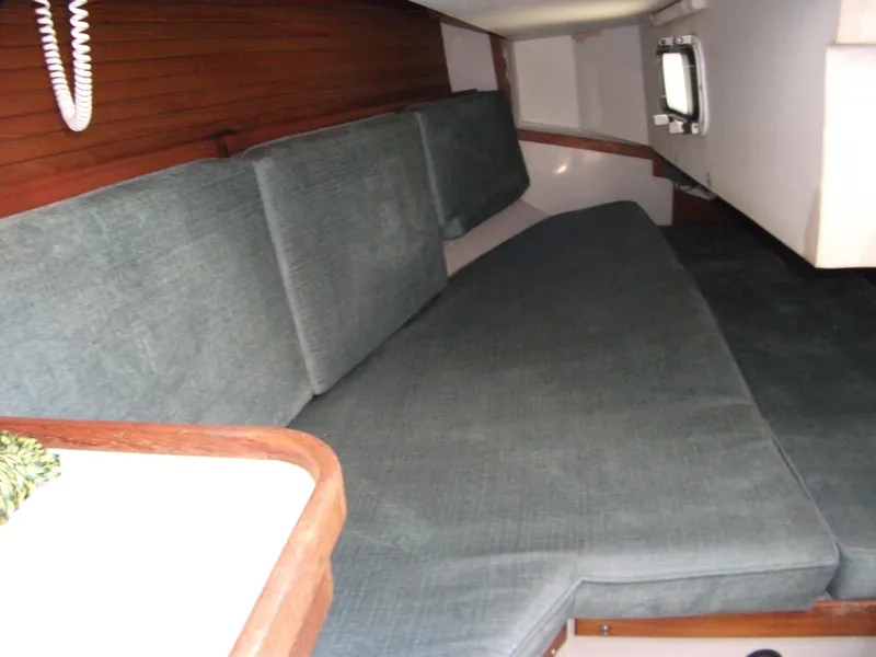 Slide: The Image of Interior cabin of a 1992 Catalina 30 MkII sailboat with cushioned seating. - 17