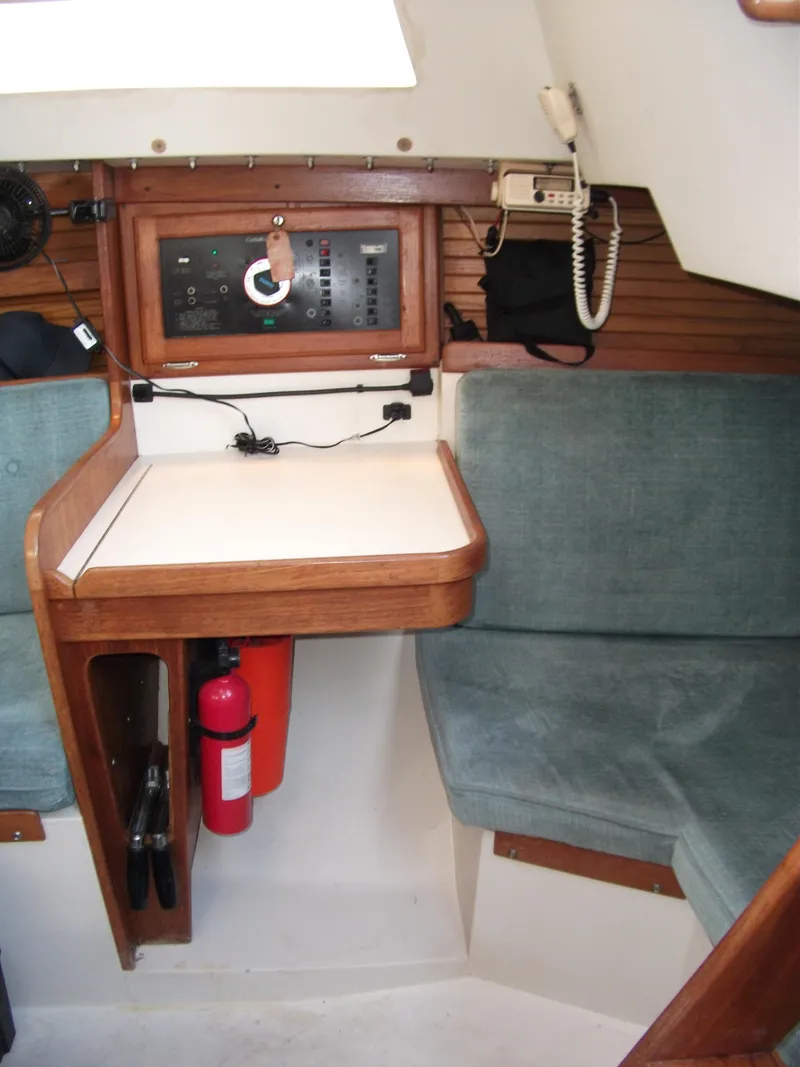 Slide: The Image of 1992 Catalina 30 MkII yacht interior with navigation station and seating area. - 18