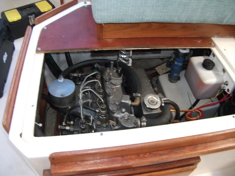 Slide: The Image of Engine compartment of a 1992 Catalina 30 MkII sailboat, showcasing mechanical components. - 21