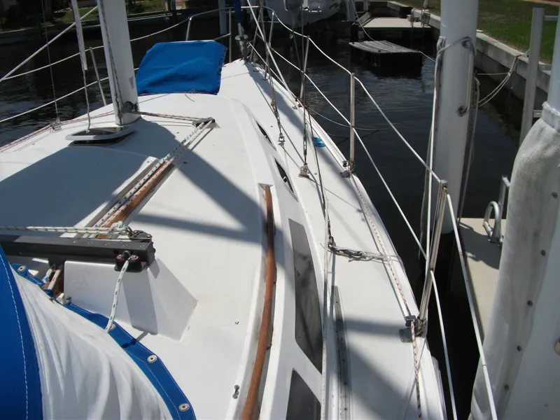 Slide: The Image of 1992 Catalina 30 MkII sailboat deck with rigging and blue sail cover. - 28