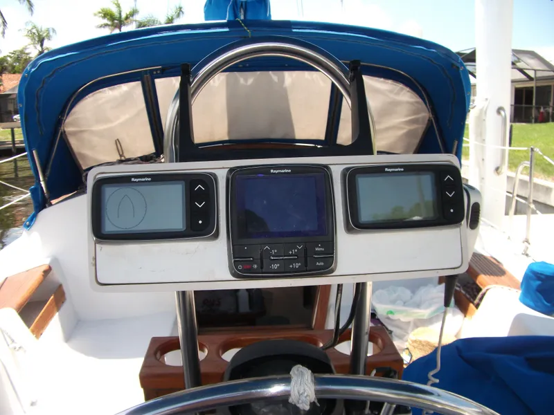 Slide: The Image of Cockpit of 1992 Catalina 30 MkII sailboat with navigation instruments and blue canopy. - 31