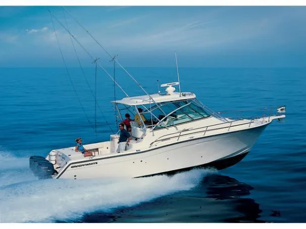 Slide: The Image of 2006 Grady-White Express 360 boat cruising on open water, clear blue sky. - 1