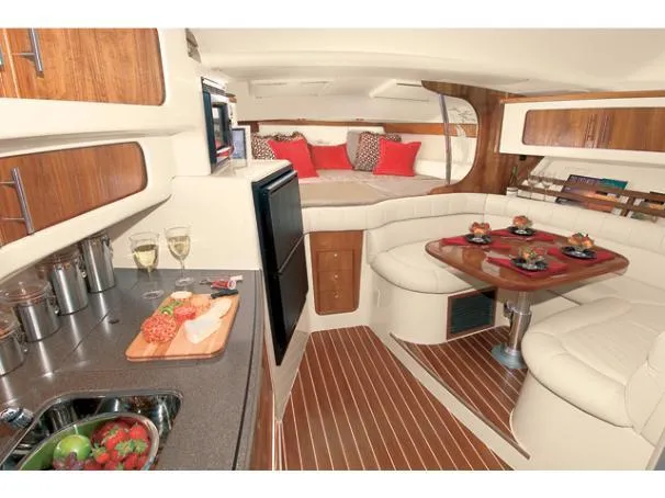 Slide: The Image of Luxurious interior of 2006 Grady-White Express 360 yacht with dining area and kitchenette. - 2