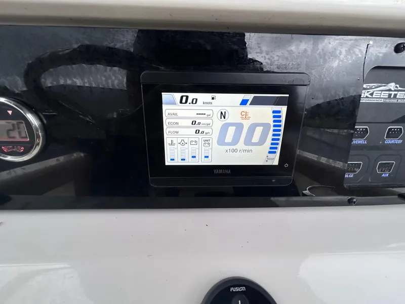 Slide: The Image of Dashboard of 2023 Skeeter SX 2250 boat with digital display and controls. - 11
