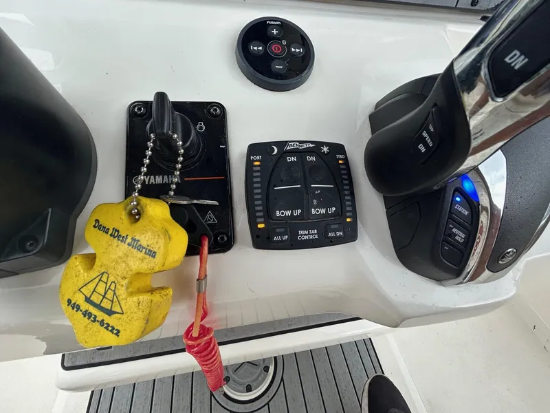 Slide: The Image of Control panel of a 2023 Skeeter SX 2250 boat with Yamaha key and trim controls. - 12