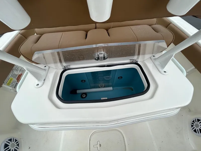 Slide: The Image of 2023 Skeeter SX 2250 boat on trailer, parked outdoors on a cloudy day. - 2