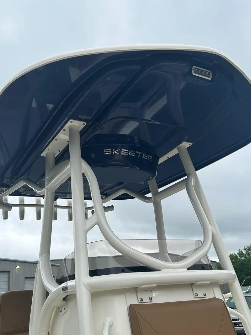 Slide: The Image of 2023 Skeeter SX 2250 boat with T-top, showcasing sleek design and sturdy construction. - 6