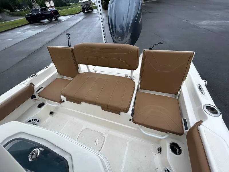 Slide: The Image of 2023 Skeeter SX 2250 boat interior with tan seating and white deck. - 9