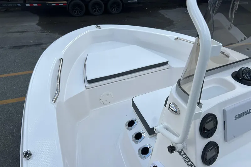 Slide: The Image of 2026 Robalo R160 Center Console boat interior with seating and control panel. - 15