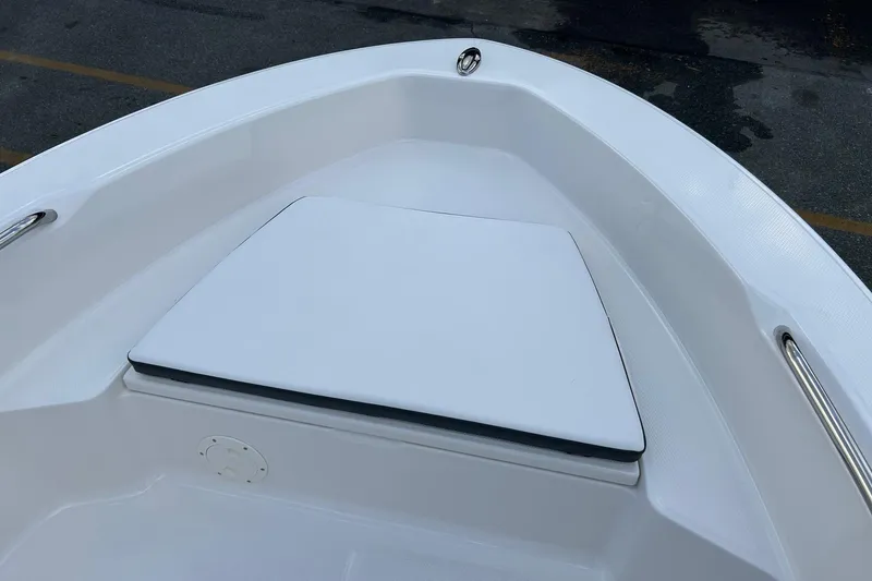 Slide: The Image of 2026 Robalo R160 Center Console boat bow with cushioned seating. - 16