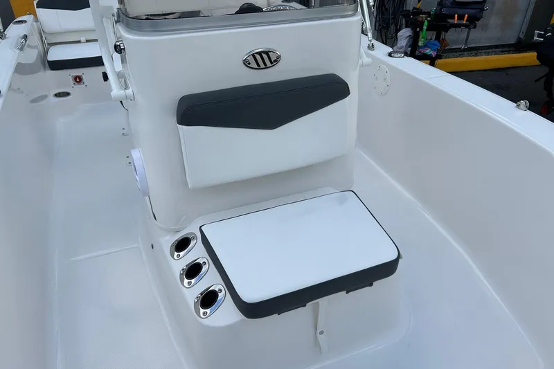 Slide: The Image of 2026 Robalo R160 Center Console boat interior with seating and rod holders. - 19