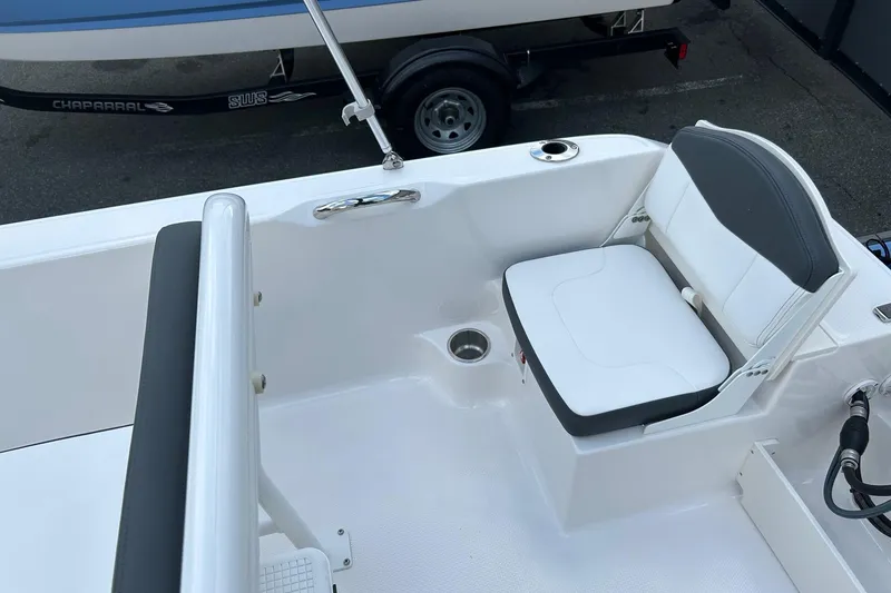 Slide: The Image of 2026 Robalo R160 Center Console boat interior with white seating and stainless steel fixtures. - 21