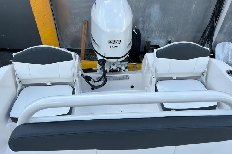 Slide: The Image of 2026 Robalo R160 Center Console boat with Yamaha 90 engine, rear seating view. - 24
