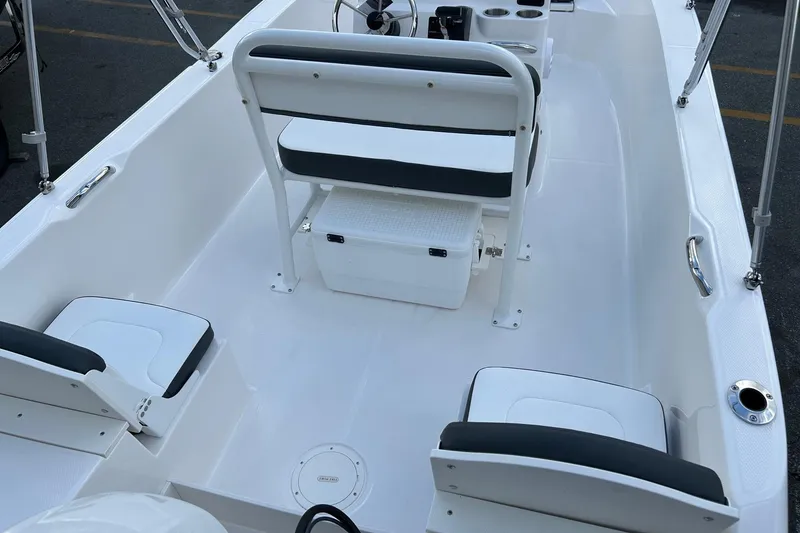 Slide: The Image of 2026 Robalo R160 Center Console boat interior with seating and storage. - 25