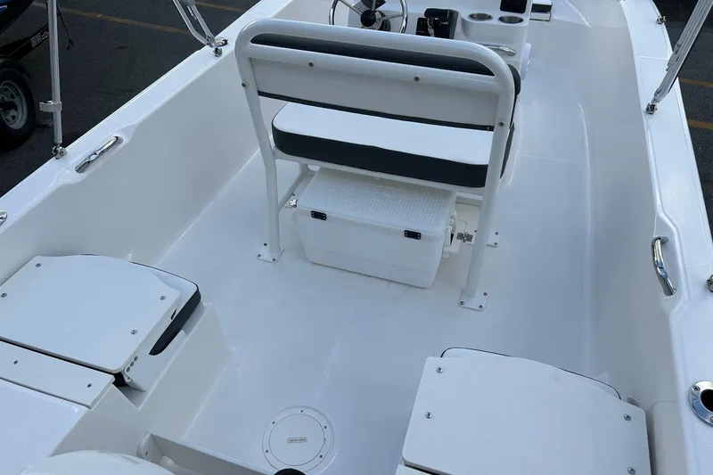 Slide: The Image of 2026 Robalo R160 Center Console boat interior with seating and storage compartments. - 26