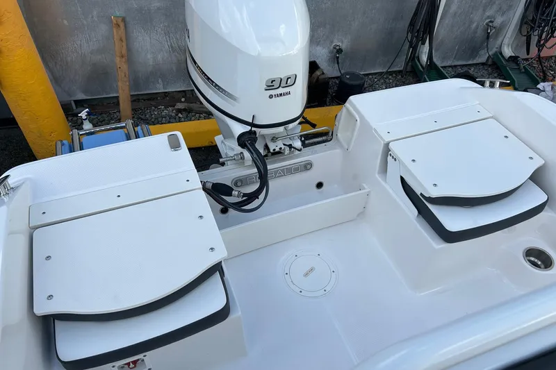 Slide: The Image of 2026 Robalo R160 Center Console boat with Yamaha 90 engine, rear seating view. - 27