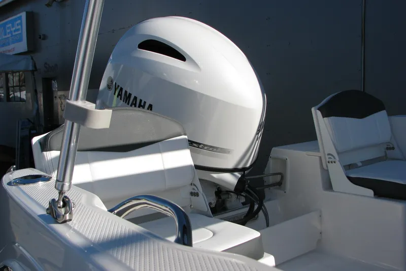 Slide: The Image of 2026 Robalo R160 Center Console boat with Yamaha engine, featuring sleek seating and modern design. - 31