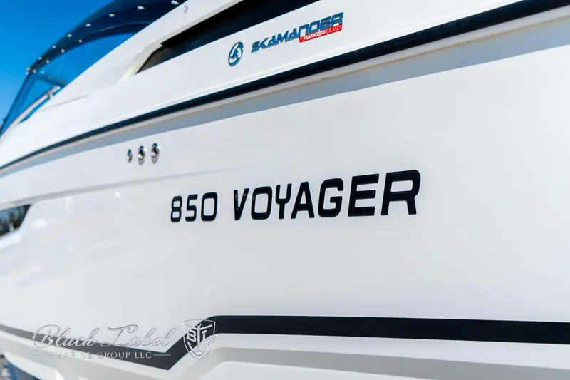 Slide: The Image of Hussar 850 Voyager boat, 2023 model, sleek white design with branding details. - 14
