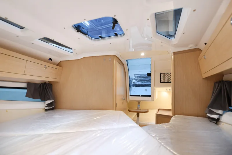 Slide: The Image of Interior of 2023 Hussar 850 camper, featuring modern design and spacious sleeping area. - 8