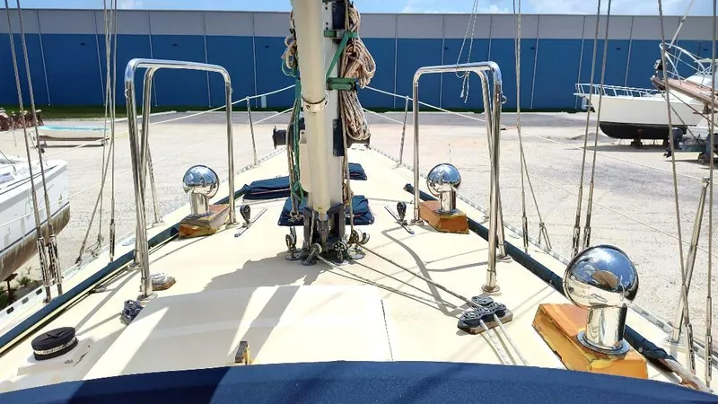 Slide: The Image of 1985 Tayana Vancover 42 sailboat deck with polished fittings and rigging. - 14