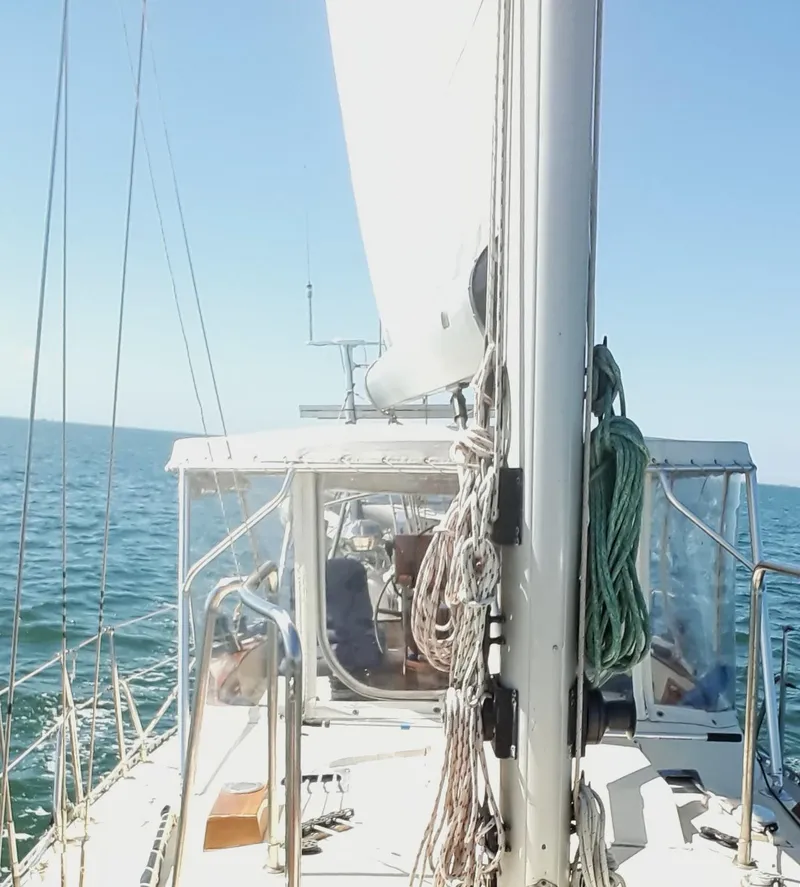 Slide: The Image of Sailing on a 1985 Tayana Vancover 42 yacht, clear blue sea and sky. - 16