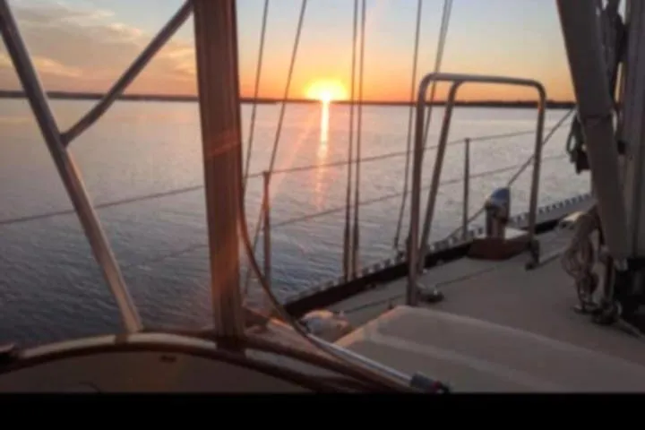 Slide: The Image of Sailing at sunset on a 1985 Tayana Vancover 42 yacht. - 25
