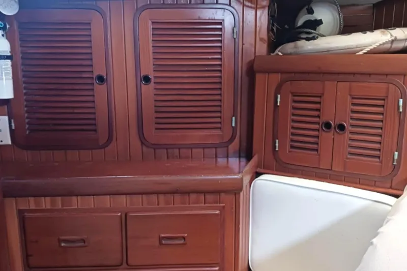 Slide: The Image of Interior of 1985 Tayana Vancover 42 sailboat with wooden cabinets and drawers. - 28