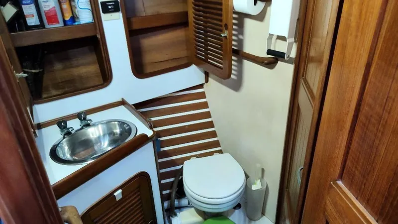 Slide: The Image of Compact bathroom in 1985 Tayana Vancover 42 yacht with sink and toilet. - 31