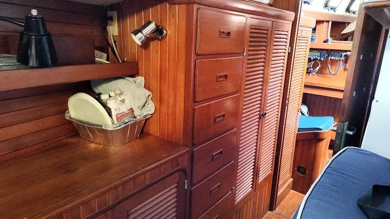 Slide: The Image of Interior of 1985 Tayana Vancover 42 sailboat with wooden cabinetry and storage. - 34