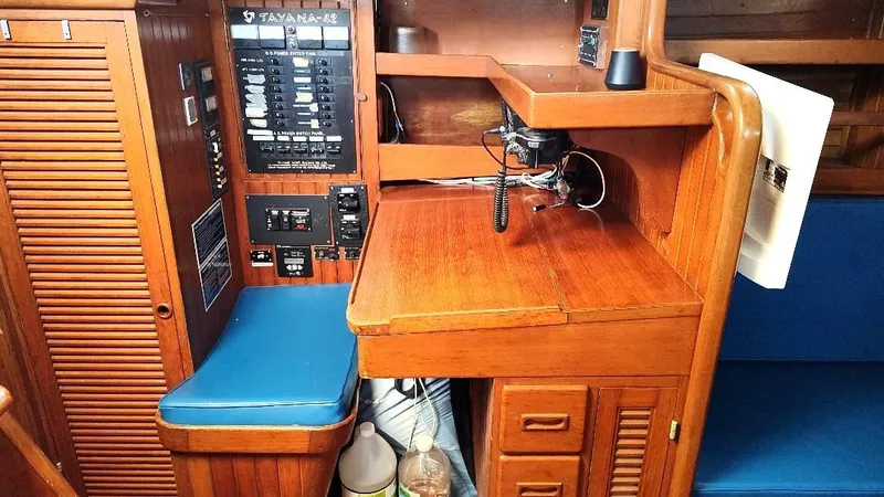 Slide: The Image of Interior of 1985 Tayana Vancover 42 sailboat with navigation station and control panel. - 37