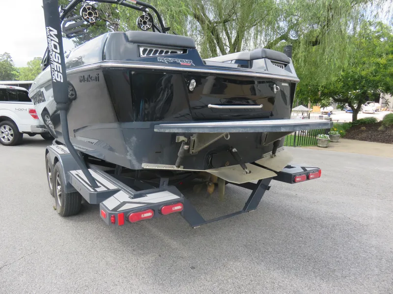 Slide: The Image of 2020 Moomba Makai boat on trailer, rear view, parked outdoors. - 2