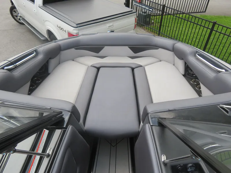 Slide: The Image of 2020 Moomba Makai boat interior with gray seating and sleek design. - 4