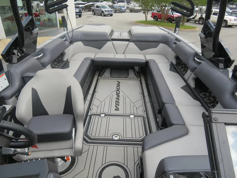 Slide: The Image of 2020 Moomba Makai boat interior with gray seating and branded flooring. - 5