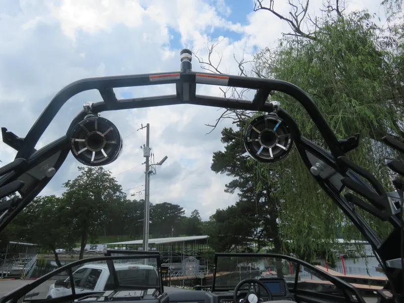 Slide: The Image of 2020 Moomba Makai boat with speakers and tower against a cloudy sky. - 9