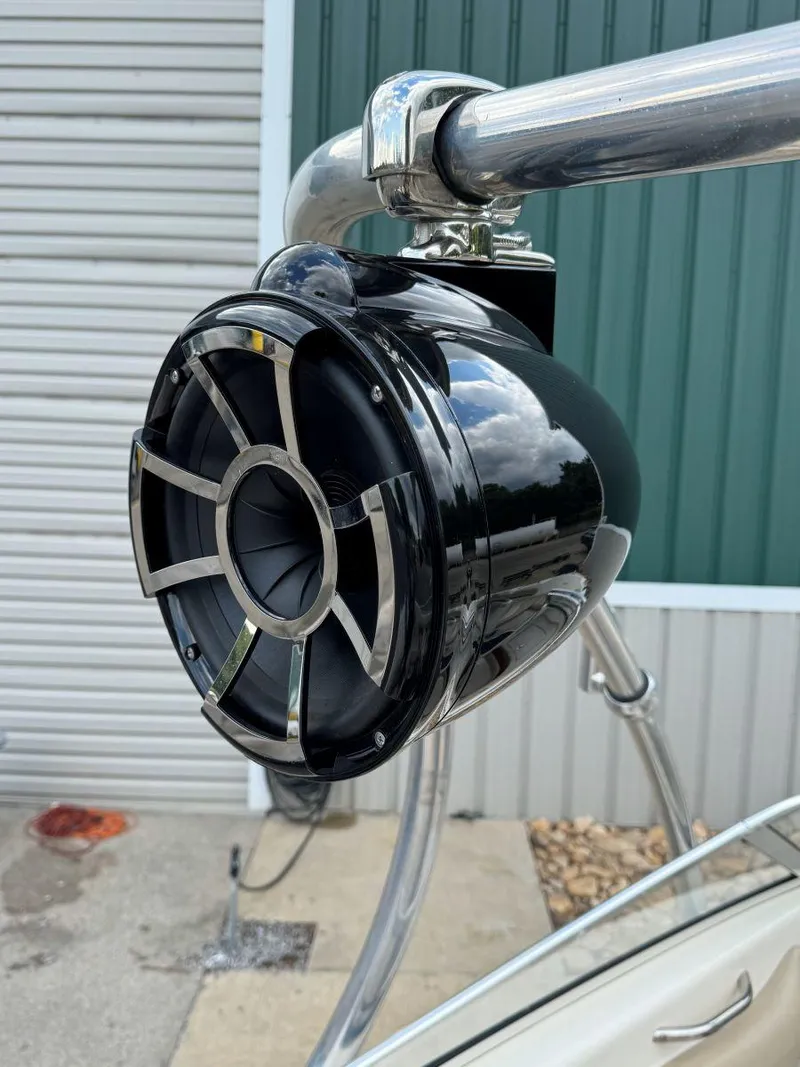 Slide: The Image of Close-up of a black marine speaker on a 2006 Glastron GX 235 boat. - 14