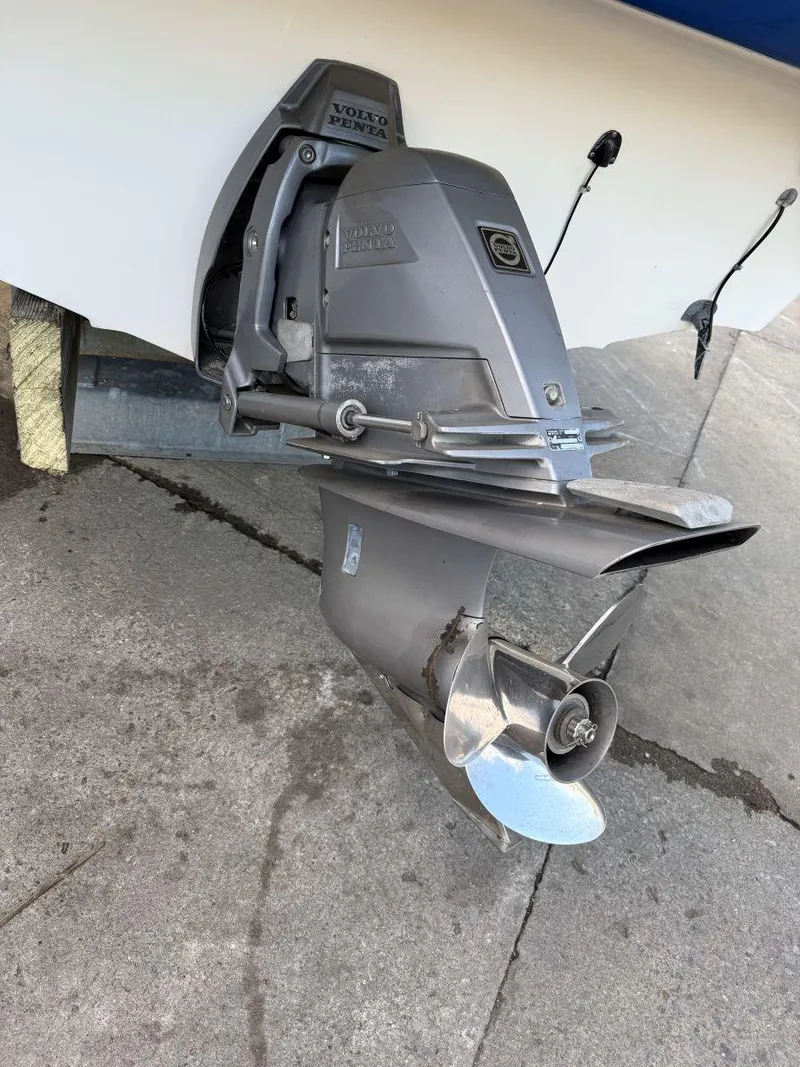 Slide: The Image of 2006 Glastron GX 235 boat outboard motor on concrete surface. - 4