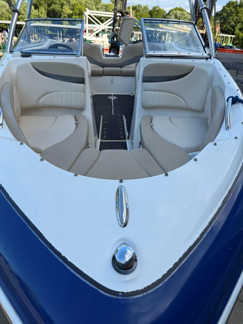 Slide: The Image of 2006 Glastron GX 235 boat with spacious seating and sleek design. - 5