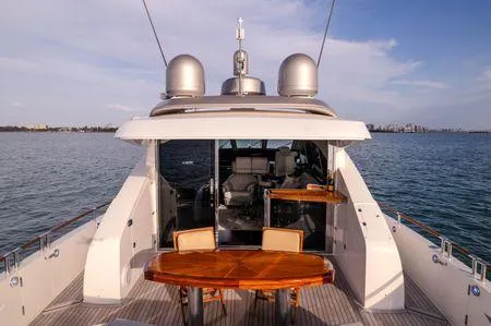 Slide: The Image of Luxurious 2007 Lazzara LSX 75 yacht with elegant outdoor seating and ocean view. - 13